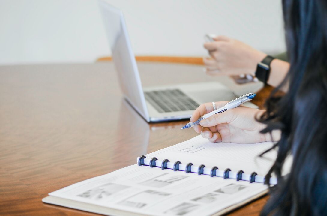 Woman writing at work